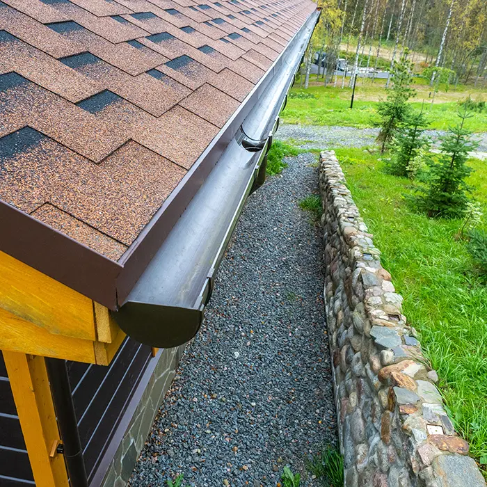 Close up of newly installed gutter and roof system