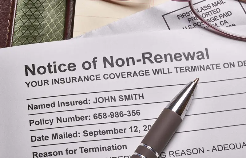 Insurance coverage documents and pen